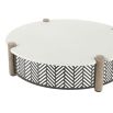 Round coffee table with a concrete top, four wooden dowels, and a black and white geometric print exterior