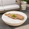 Round concrete coffee table with fluted edges