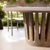 Circular outdoor dining table with tapered crown base