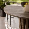 Circular outdoor dining table with tapered crown base
