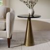 Side table with sharp antique brass base and black round table top