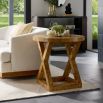 Side table with X frame and circular tabletop in blonde burl olive ash veneer