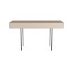 Desk encased in grey leather balancing on blade-like bronze legs