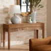 Console table with abaca fringing