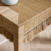 Console table with abaca fringing