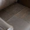 Armchair in brown leather in angular frame