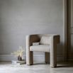 Upholstered cream armchair with open sides