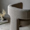 Upholstered cream armchair with open sides