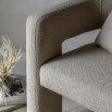 Upholstered cream armchair with open sides