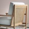 Wooden armchair with single rattan on seat base and double layer on back, with cream back and seat cushions