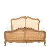 French-style wooden bed with rattan headboard