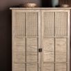 Wooden two door cupboard with rattan detailing
