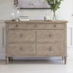 Light wooden seven drawer chest of drawers