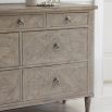 Light wooden seven drawer chest of drawers