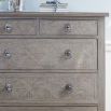 Light wooden five drawer chest of drawers