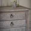 Tall light wooden five drawer chest