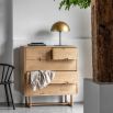 Stylish wooden chest of drawers with exposed corners