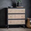 Black framed three drawer chest table with natural rattan fronted drawers