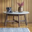 Round coffee table in walnut stained wood with marble top