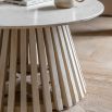 Marble top coffee table with gentle sloping slats for base
