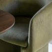 Tub-shaped dining chair with smooth green fabric