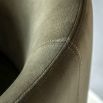 Tub-shaped dining chair with smooth green fabric