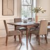 Minimalist dining chair in pale grey with upholstered seat