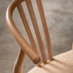 Wishbone back dining chairs with deeply curved back and distinctive hand woven seat