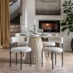 Marble top round dining table with gentle sloping slats for base