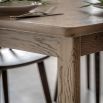 Wooden dining table with shaped underframe