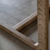 Wooden dining table with shaped underframe
