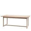 Wooden dining table with shaped underframe