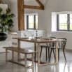 Wooden dining table with shaped underframe