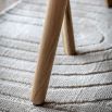 Triangular wooden dining table with three legs