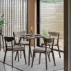 Square wooden dining table with four legs