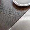Square wooden dining table with four legs