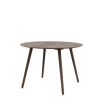 Round wooden dining table with four legs