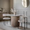 Wood dining table with striking vertical ribbed feature on drum base and polished marble top