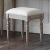 Light wooden stool with cushion