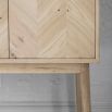 Warm wooden cocktail cabinet with chevron design