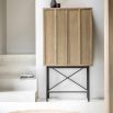 Beautiful cocktail cabinet in oak veneer with a weathered grey finish, paired with black metal legs