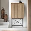 Beautiful cocktail cabinet in oak veneer with a weathered grey finish, paired with black metal legs