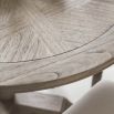 Round light wooden dining table