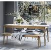 Warm wooden extendable dining table with chevron design