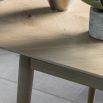 Warm wooden extendable dining table with chevron design