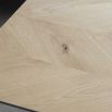 Warm wooden extendable dining table with chevron design
