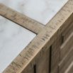 Wooden kitchen island with inset marble slabs on the top, three drawers and two large shelves