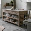 Wooden kitchen island with inset marble slabs on the top, three drawers and two large shelves