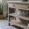 Wooden kitchen island with inset marble slabs on the top, three drawers and two large shelves