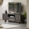 Dark wood media unit with arch patterns and round ball feet